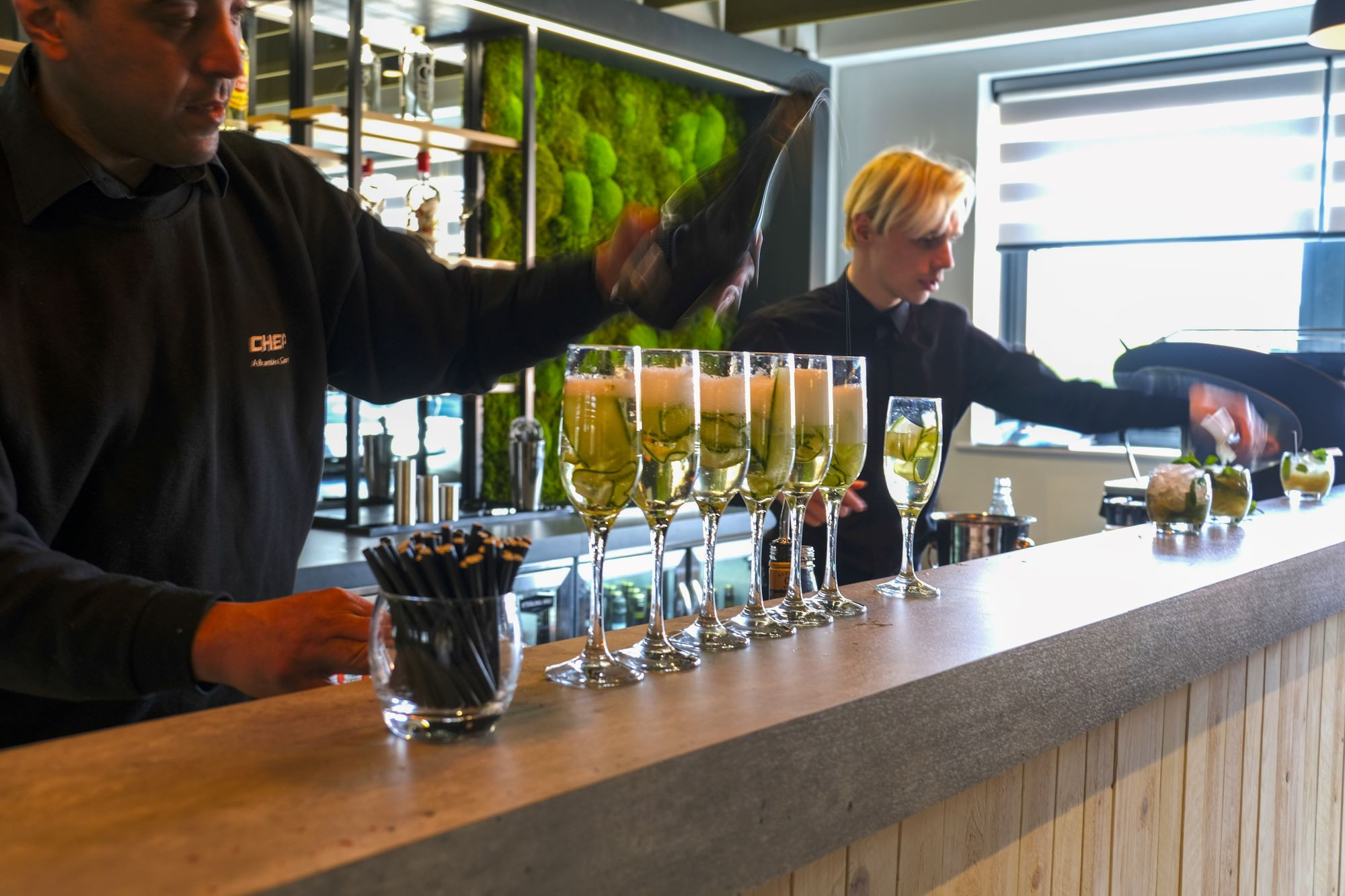 bar staff serving drinks at the loft bar